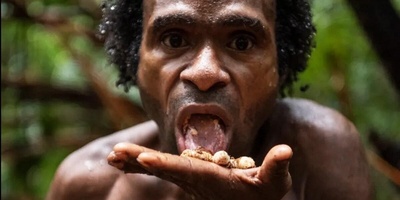Incredible Images of the World's Last Known Cannibalistic Tribe: The Rituals Behind Killing and Consuming Outsiders