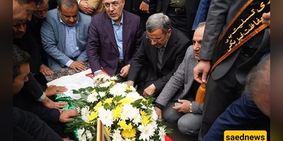 Flashback: Ahmadinejad Kneels Beneath His Transport Minister’s Casket in Rare Show of Reverence