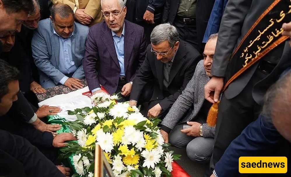 Flashback: Ahmadinejad Kneels Beneath His Transport Minister’s Casket in Rare Show of Reverence