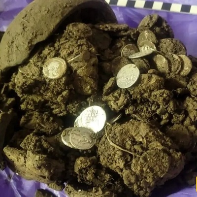 Discovery Of A Treasure Trove Of Roman Coins During A Walk In The Forest