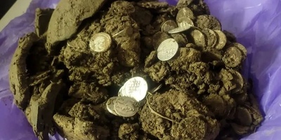 Discovery Of A Treasure Trove Of Roman Coins During A Walk In The Forest