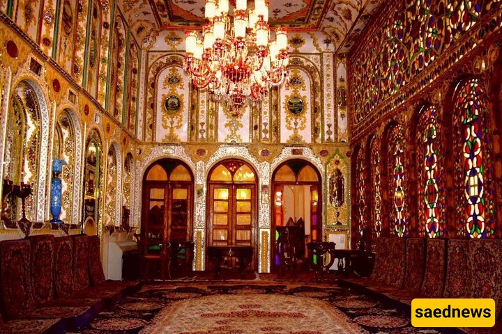 The illuminated Motamedi House in Isfahan, With its Wooden Doors, Colorful Glass Windows, and Authentic Iranian Decor, Will Captivate Your Eyes.