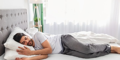 Why Do Some People Sleep With Their Legs Drawn Up?