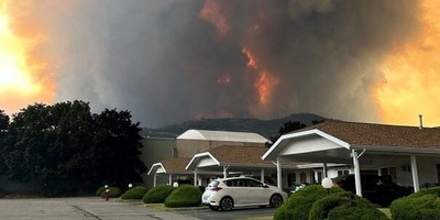 Homes Burn as More Than 20,000 People Are Forced to Evacuate in British Columbia