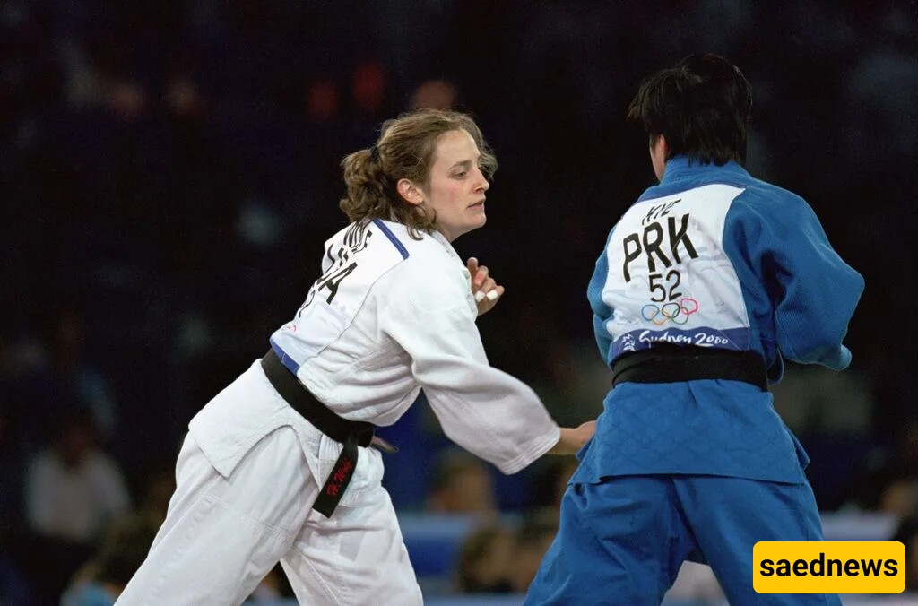 Hillary Wolf competing against San Hui Kye in the Olympic Games