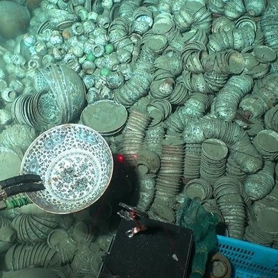 Thousands of Ancient Coins Accidentally Discovered Deep Under the Sea