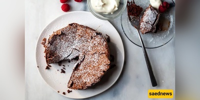 This tiny, soufflé-like chocolate cake puffs up into an impossibly flaky top, collapses into molten, fudgy crumbs, and will make you cancel every bakery run from now on.