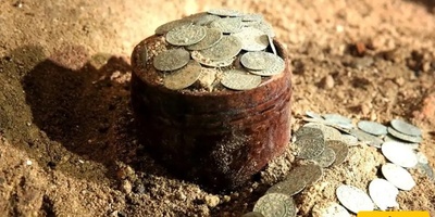 400-Year-Old Coin Treasure Unearthed Beneath an Ancient Church