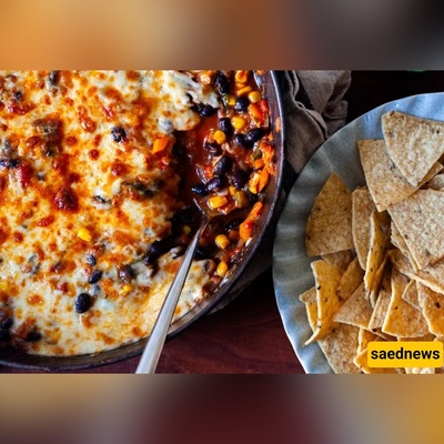 Cover Your Veggies in Cheese: The Giant Black Bean Bake You’ll Scoop with Chips