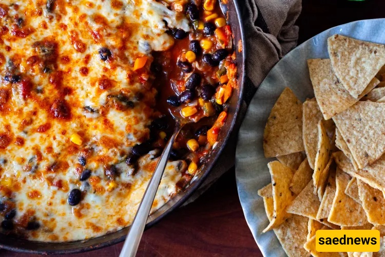 Cover Your Veggies in Cheese: The Giant Black Bean Bake You’ll Scoop with Chips