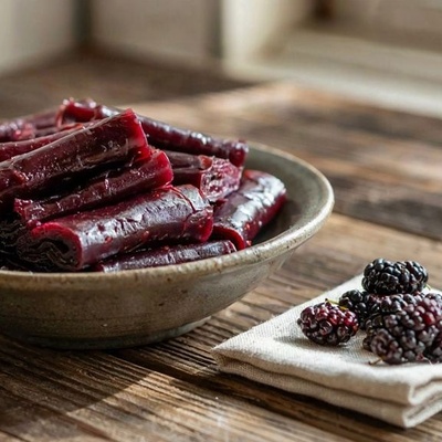 Calories and Nutritional Value of Black Mulberry Fruit Leather: Benefits, Potential Risks, and Homemade vs. Industrial Comparison