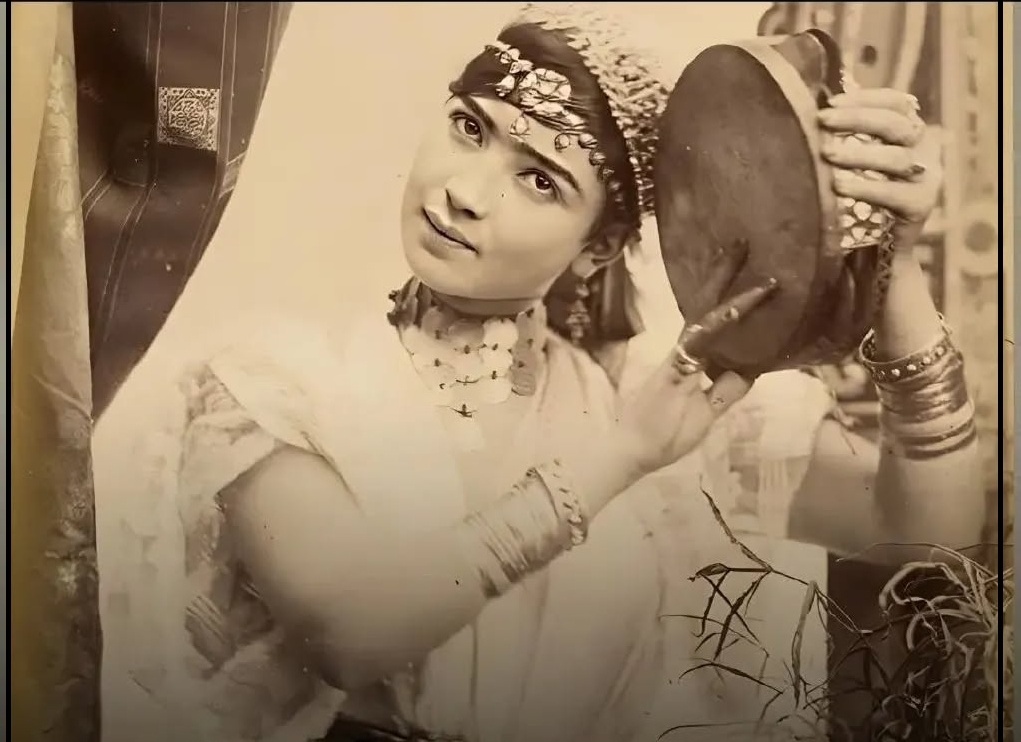 TwoPaintings by Naser al-Din Shah Qajar of a Beautiful European Woman Beside an Iranian Samovar, Pouring Tea, Wearing a Boat-neck Blouse and a Puffed Skirt / dated 1263 (1884-1885 CE).