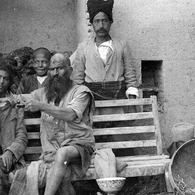 A Historic and Rare Photo of a Thief Being Flogged in Public During the Qajar Era by a Policeman / When Sentences Were Carried Out in the Town Square