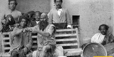 A Historic and Rare Photo of a Thief Being Flogged in Public During the Qajar Era by a Policeman / When Sentences Were Carried Out in the Town Square
