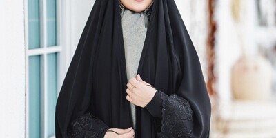 What Is the Ruling on Wearing a Black Chador According to Islamic Jurisprudential Authorities?