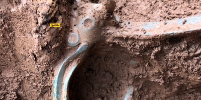Discovery of a 2,000-Year-Old Hoard of Cooking Pots and a Long-Tongued Bronze Bull