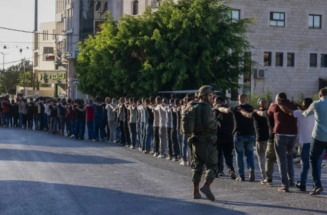 Shocking Footage Shows Israeli Soldiers Marching Palestinians in Lines