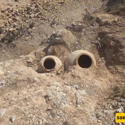 Ancient Clay Jars Unearthed Following Road Erosion In Western Iran