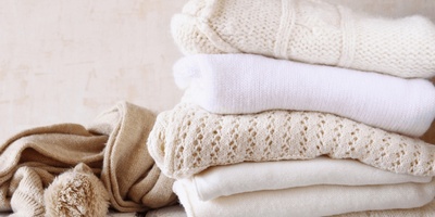Why do some stains come off with hot water and others with cold water?