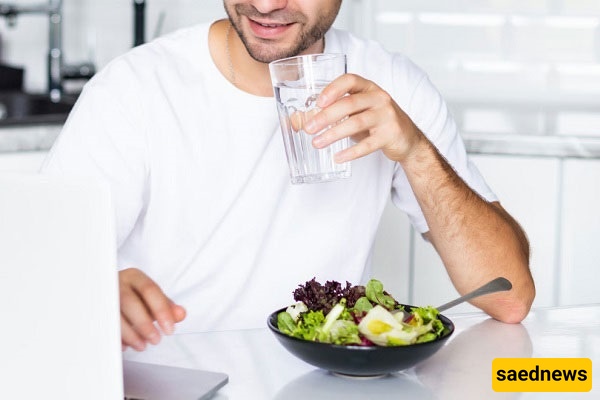 drinking a glass of water 