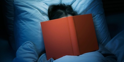 Why Do You Feel Sleepy When Reading in Bed?